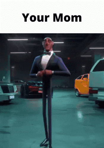 a man in a tuxedo and bow tie is standing in a garage with cars and the words your mom above him