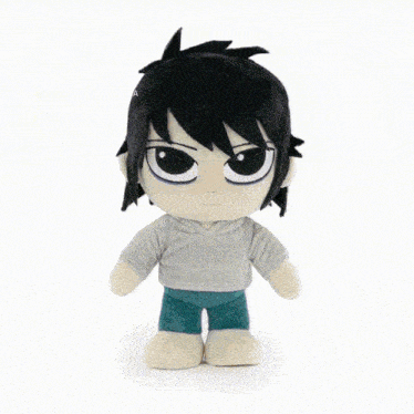 a stuffed toy of a boy with black hair and a grey shirt