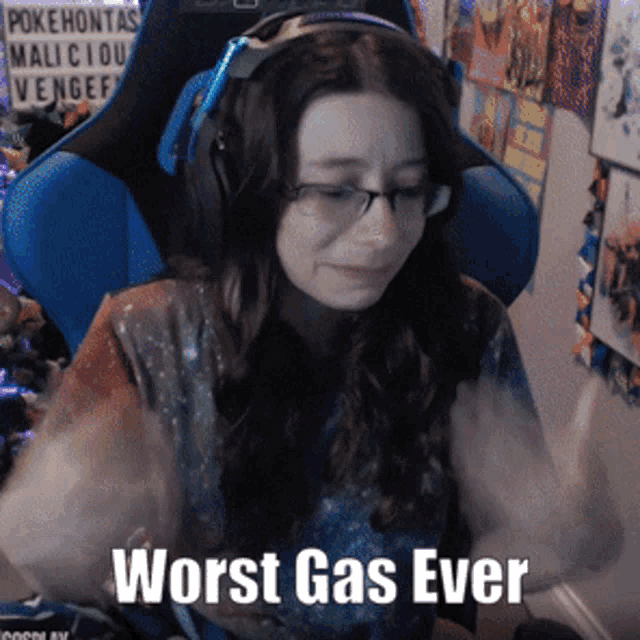 a woman wearing headphones and glasses is sitting in a chair with the words worst gas ever above her