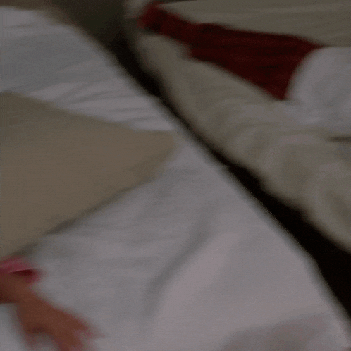 a woman in a pink pajama with hearts on it