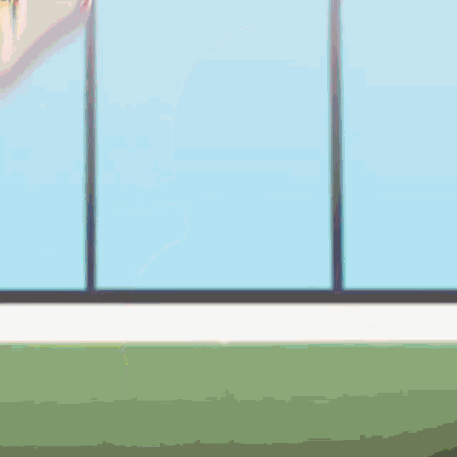 a blurry picture of a girl in a yellow and white striped outfit