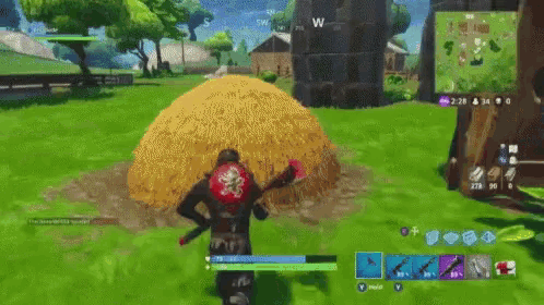 a person in a video game is standing in front of a haystack