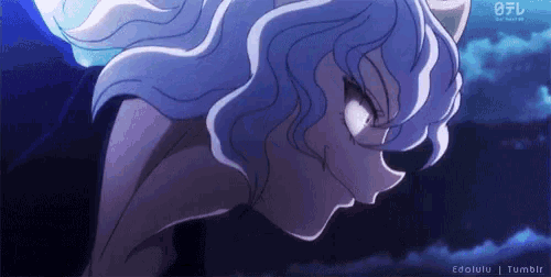 a close up of a person 's face with a blue background