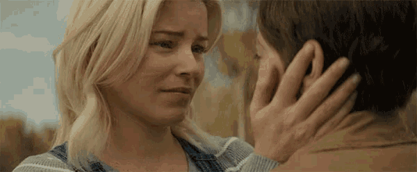 a man and a woman are touching their foreheads