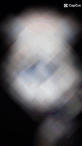 a blurred image of a person 's face with the caption capcut at the bottom