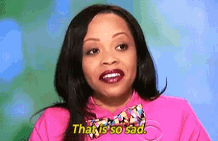 a woman wearing a pink shirt and bow tie says that is so sad
