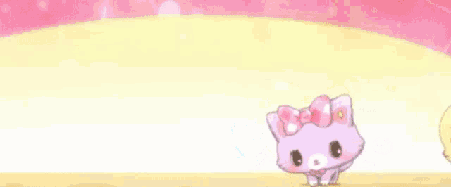 a group of cartoon cats are standing next to each other on a pink background .