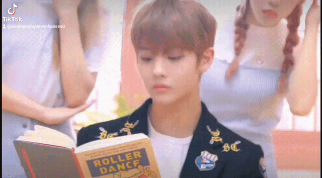a man is reading a book titled roller dance .