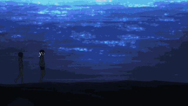 two people standing in front of a blue sky