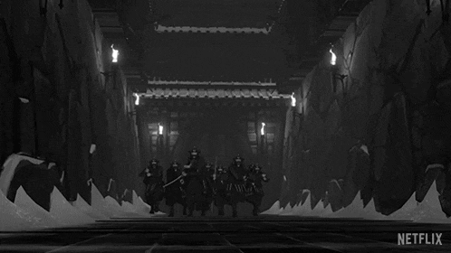 a black and white image of a group of samurai standing next to each other .