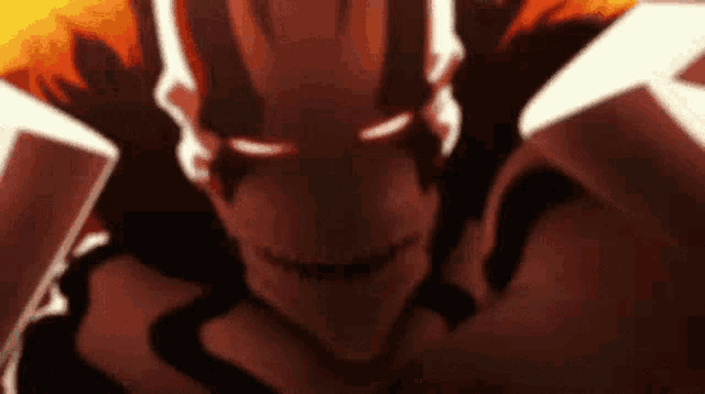a close up of a cartoon character 's face with glowing eyes and a smile .