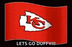 a animated gif of a chiefs flag waving in the wind .