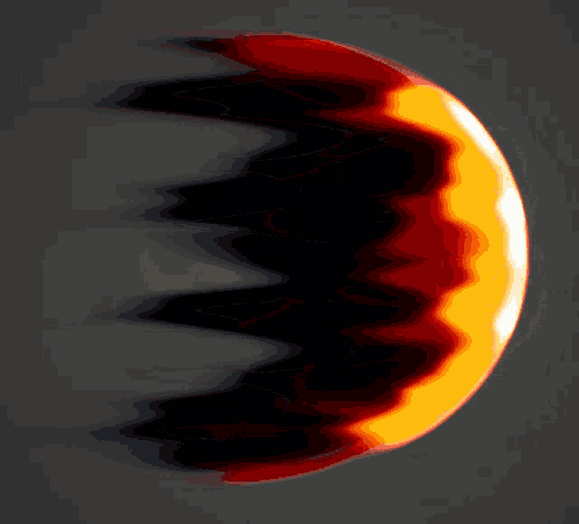 a black and orange circle with a dark shadow