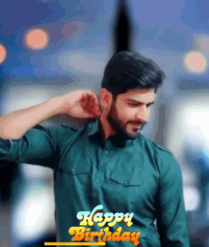 a man in a green shirt with the words happy birthday written on the bottom