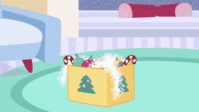 a yellow box with christmas trees and candy canes
