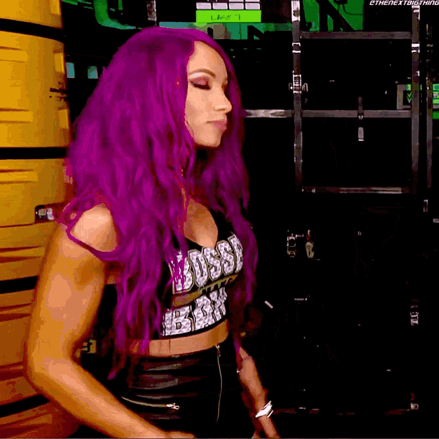 a woman with purple hair is wearing a boss baby top
