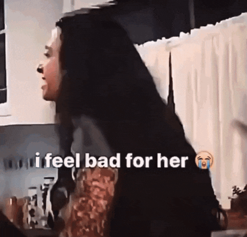 a woman with long black hair is crying and says i feel bad for her