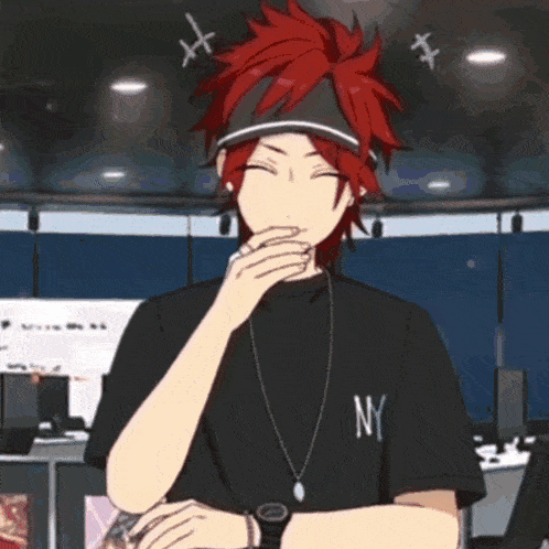a boy with red hair is wearing a black ny shirt