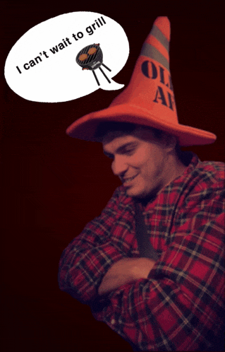 a man wearing an orange hat that says i can 't wait to grill on it