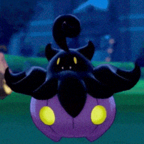 a black and purple pumpkin with yellow eyes is flying in the air .