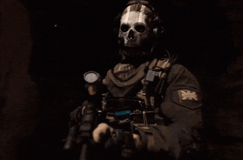 a soldier wearing a skull mask and headphones says nearly there .