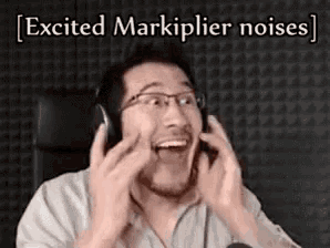 a man wearing headphones is making a funny face while sitting in front of a microphone .