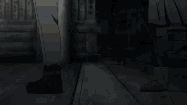 a man and a girl are looking at each other in a dark room