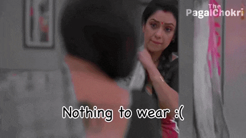 a woman is standing in front of a mirror with the words nothing to wear