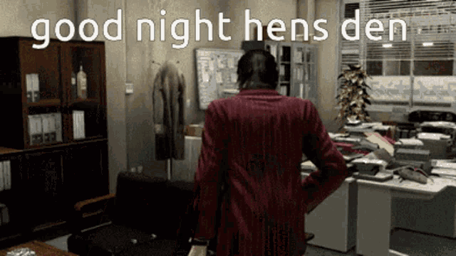 a man in a red jacket is standing in a room with the words good night hens den