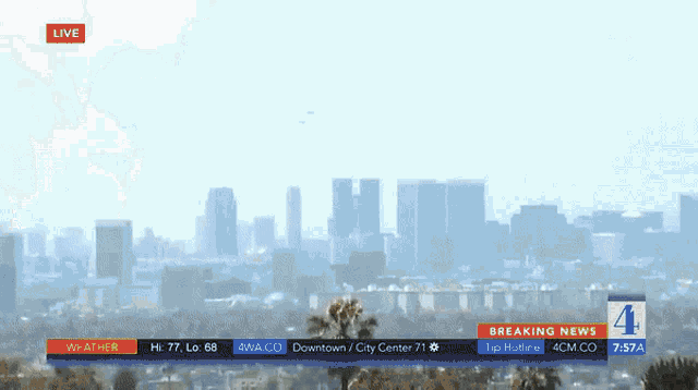 a live broadcast of a city skyline with breaking news