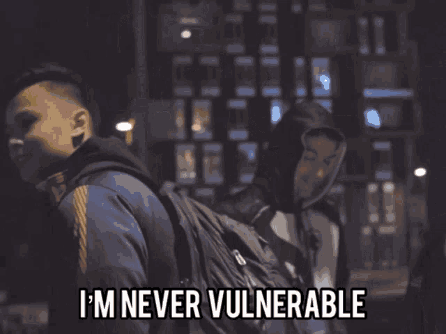 a man says " i 'm never vulnerable " in front of a group of men