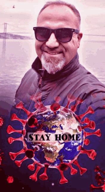 a man wearing sunglasses takes a selfie with a picture of a virus and the words " stay home "
