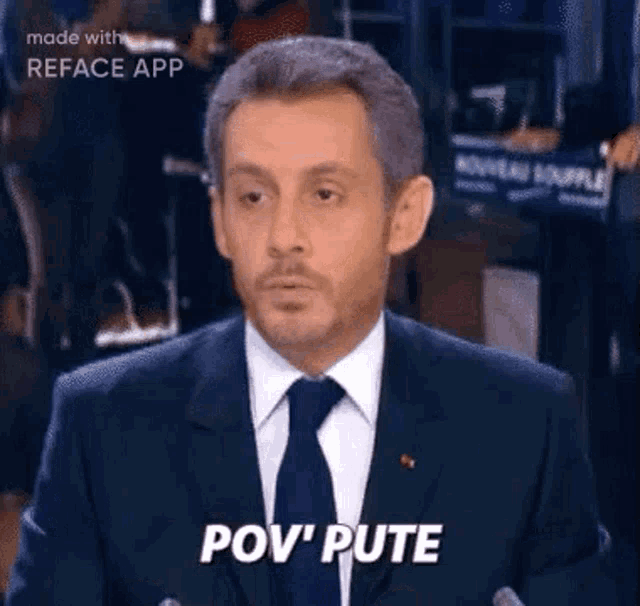 a man in a suit and tie is making a funny face and saying pov ' pute .