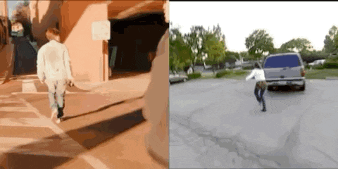 a man and a woman are walking down a street