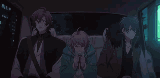 a man sitting in the back seat of a car