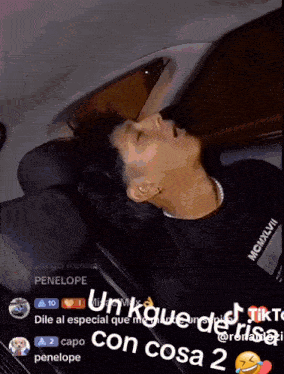 a man in a black shirt with mcmxvii on it is sleeping