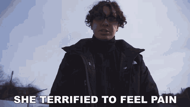 a man in a north face jacket says she terrified to feel pain in a video