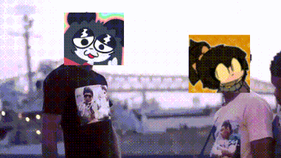 a man wearing a t-shirt with a picture of a cat on it is standing next to another man .