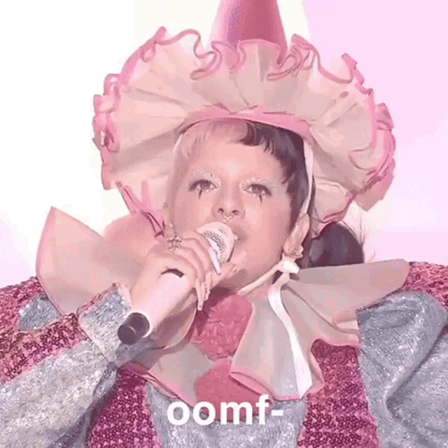a woman in a clown costume singing into a microphone