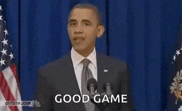 barack obama is giving a speech at a podium and the words good game are on the screen .