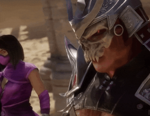 a woman in a purple mask is standing next to a man in a skull helmet