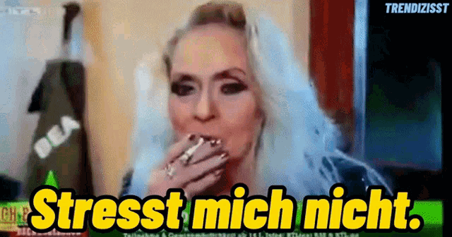 a woman smoking a cigarette with the words " stresst mich nicht " on the bottom