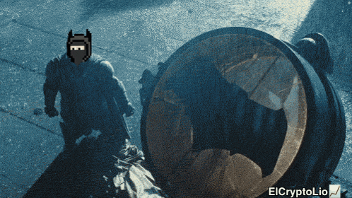 a pixelated image of batman standing next to a barrel with elcryptolio written below it