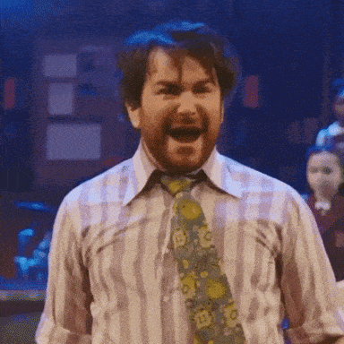 a man in a striped shirt and tie is screaming with his mouth wide open