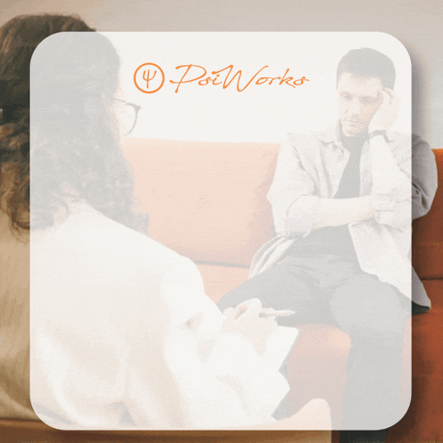 a man sits on a couch talking to a woman who is holding a pen in front of a sign that says pot works