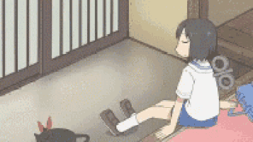 a girl in a school uniform is sitting on a rug next to a black cat .
