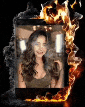 a picture of a woman with fire behind her