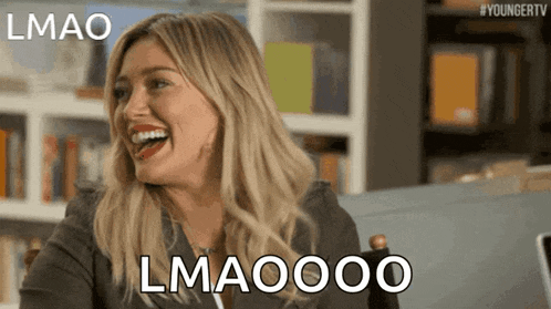 a woman is laughing with the words lmao lmaoooo behind her