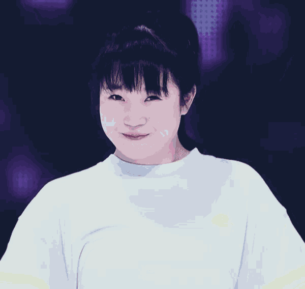 a girl wearing a white shirt with a yellow stripe is smiling