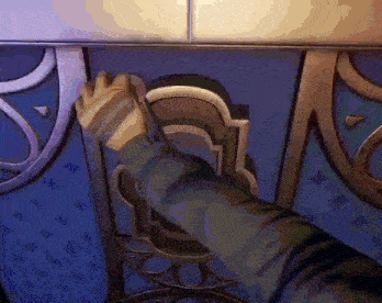 a person 's hand is reaching out to open a door in a video game .